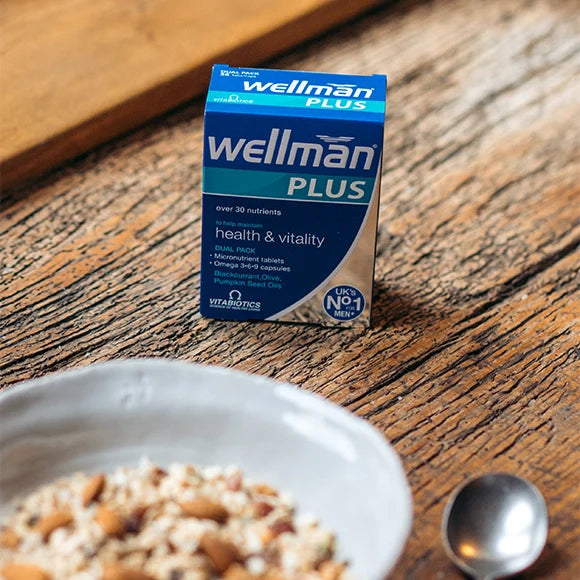 Wellman Plus - Tablets Packaging Placed on a Table