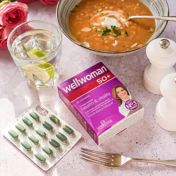 Wellwoman 50+ Multivitamins Support by Vitabiotics. Tablets Box placed on Dining Table